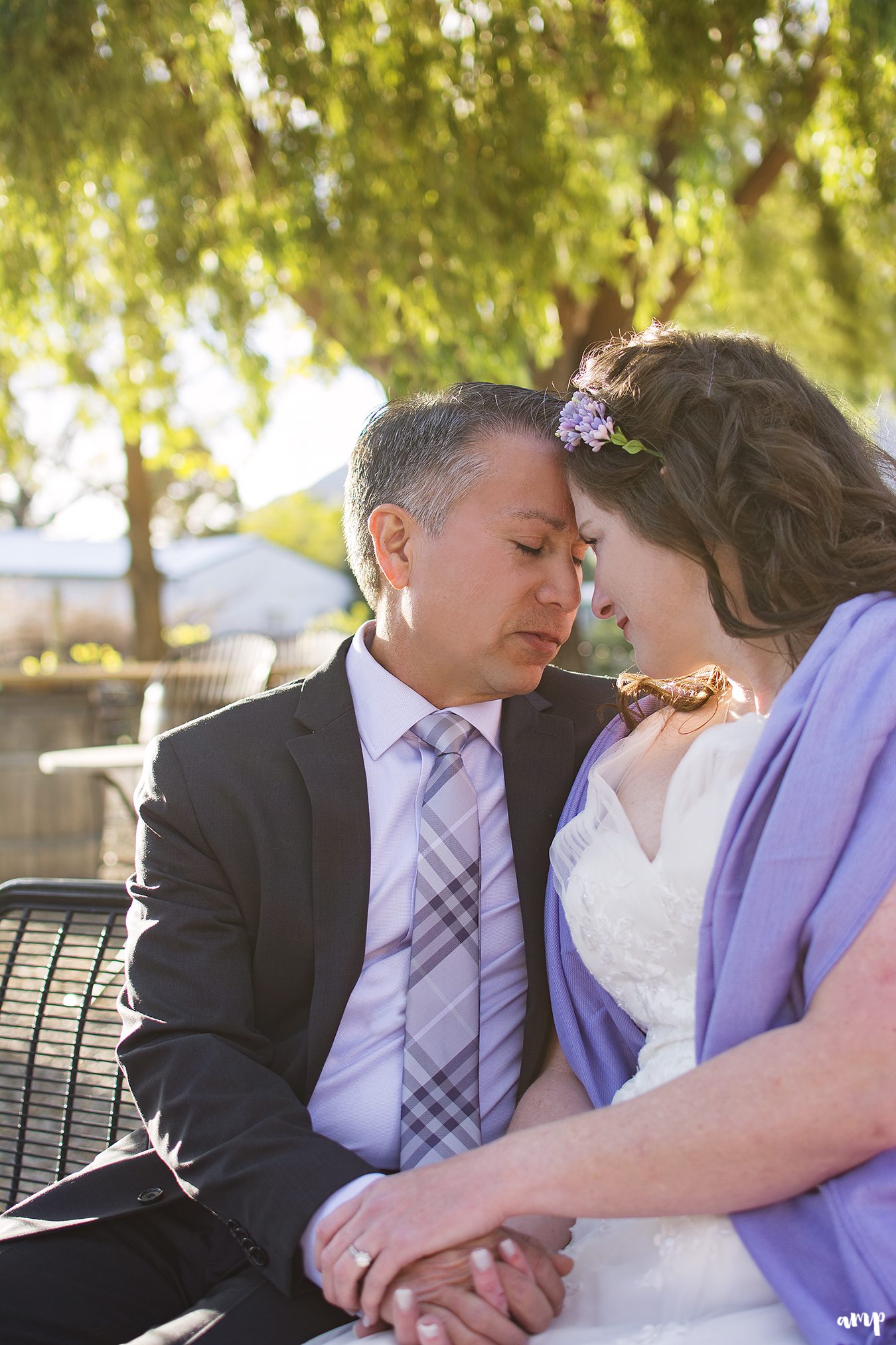 Bride and groom sharing a peaceful moment in the sunset glow
